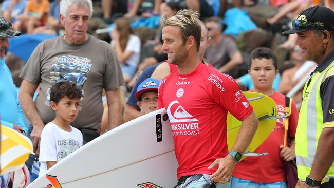 Josh Kerr makes his way through crowds on the beach during the<br/>Quiksilver Pro at Snapper Rocks. Photo: Jerad Williams.