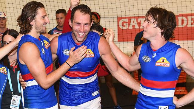 Travis Cloke celebrates after the game with Marcus Bontempelli and Liam Picken.