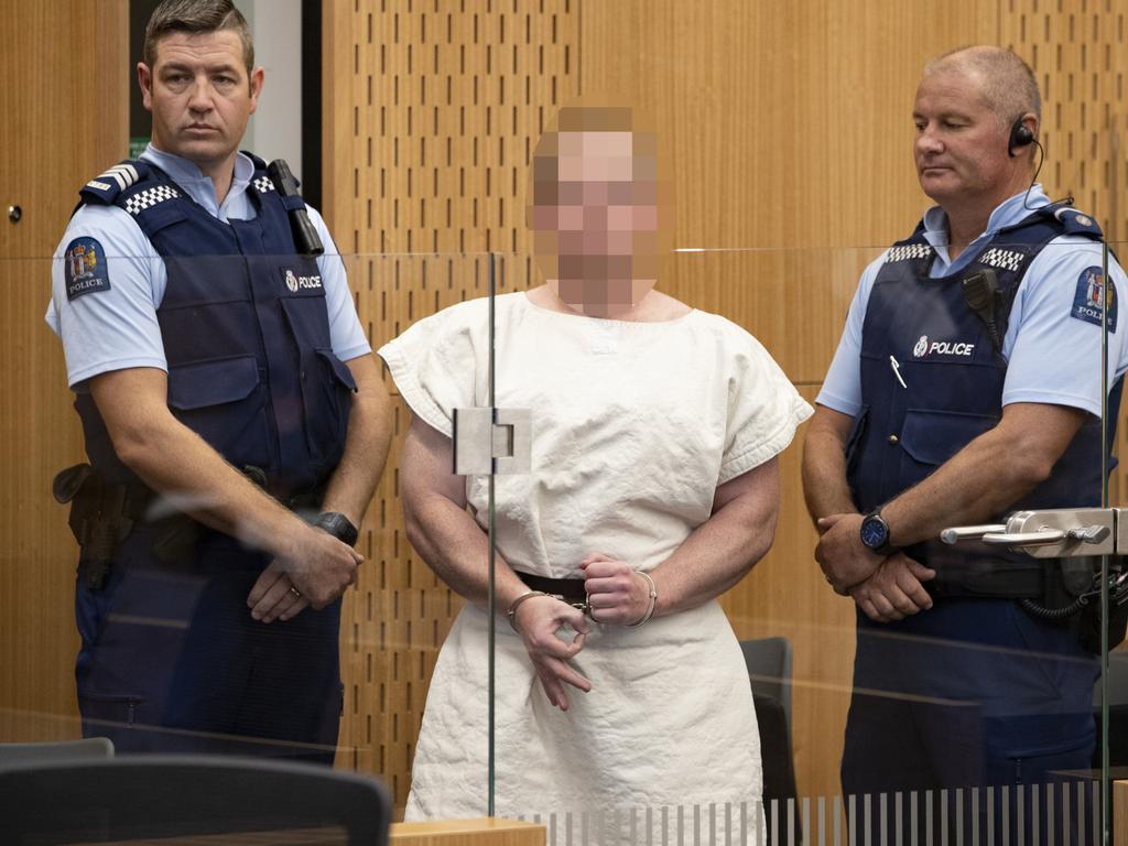 Brenton Harrison Tarrant seen making a ‘white power’ hand gesture to the camera during his three-minute court appearance on murder charges at Christchurch District Court. Picture: New Zealand Herald Mark Mitchell