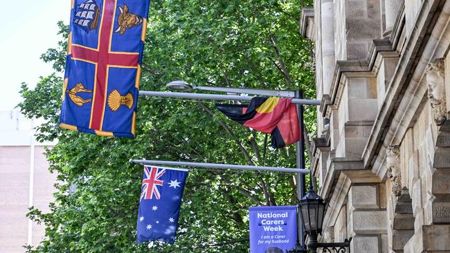 The Aboriginal flag at half-mast on the Town Hall. Picture: NCA NewsWire / Brenton Edwards