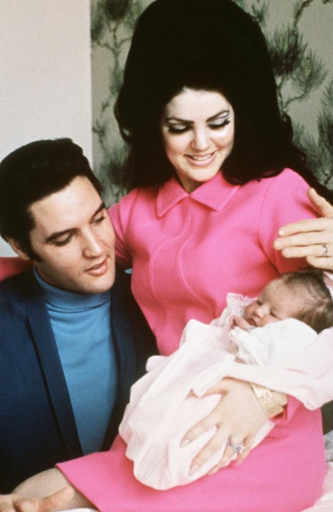 Elvis Presley and Priscilla with a then-newborn Lisa Marie in 1968.