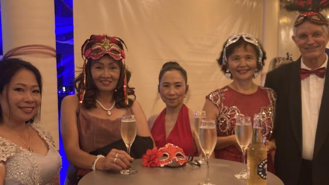 Dess McFarlane, Josie Shein, Rose Turner, Elinda Missen and Ralph Saunders celebrate at the Gympie RSL Masked Ball, April 29 2023.