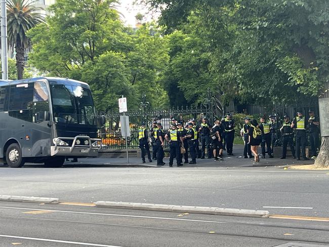 Two bus loads of police officers arrive on scene. Picture: Fergus Ellis