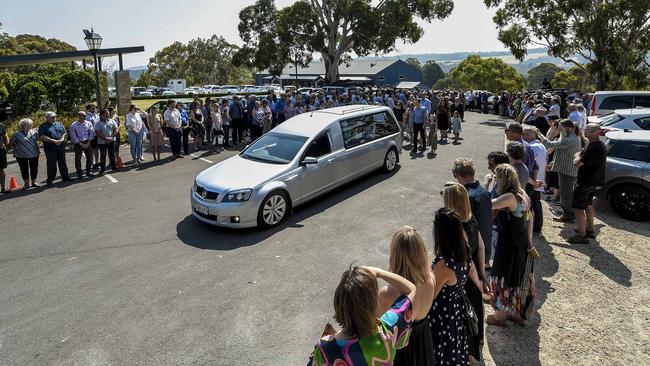 A guard of honour follows the hearse. Picture: AAP/Pic Roy VanDerVegt