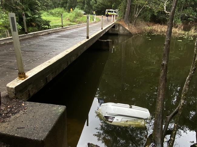 A driver and his passenger made a desperate escape after their car plunged off a bridge at Image Flat and became fully submerged. Photo: Patrick Woods.