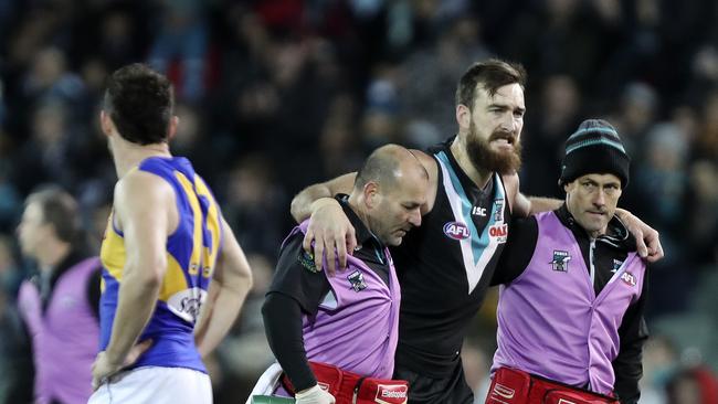 Charlie Dixon is taken off by trainers after breaking his fibula on Saturday night. Picture SARAH REED