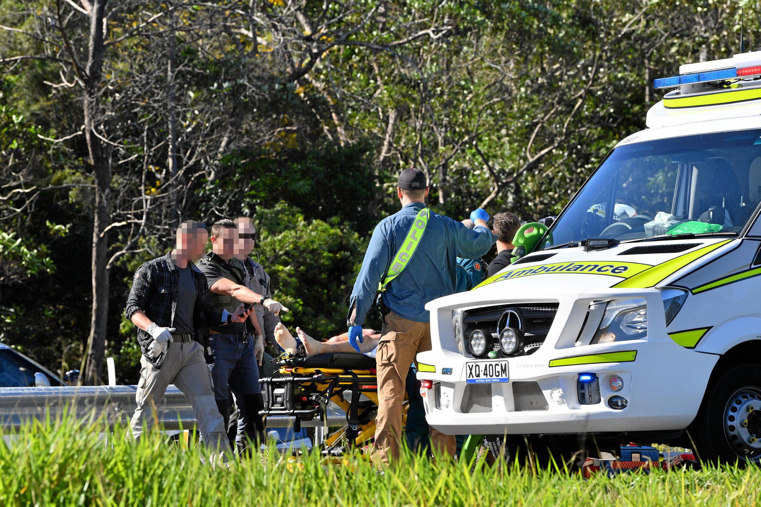 The police chased a car from north of Gympie and dozens of police apprehended a man near Parklands, just north of Nambour on the Bruce Highway. Traffic was stopped in both directions for several hours.