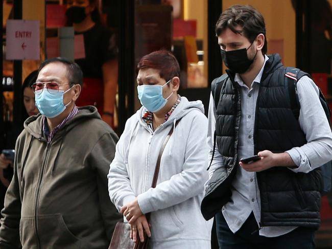 SYDNEY, AUSTRALIA - NOVEMBER 08: Pedestrians move along George Street in the CBD on November 08, 2021 in Sydney, Australia. COVID-19 restrictions have eased further today for fully vaccinated people in New South Wales as the state continues to record high vaccination rates. The relaxed rules only apply to people who are fully vaccinated with two doses of a COVID-19 vaccine. Those who are not fully vaccinated are still subject to restrictions until New South Wales reaches the 95 per cent double vaccination target, or until 15 December, whichever happens first. (Photo by Lisa Maree Williams/Getty Images)