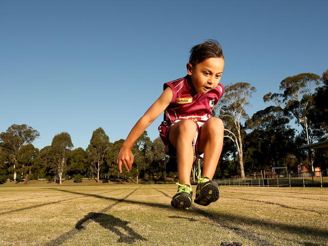 Local sports star nominee Benjamin Nasio, 5, poses for photographs at Charlie Bali reserve.Benjamin is a member of Doonside Little Athletics and has won plenty of medals and age championships.(AAP Image/ Justin Sanson)