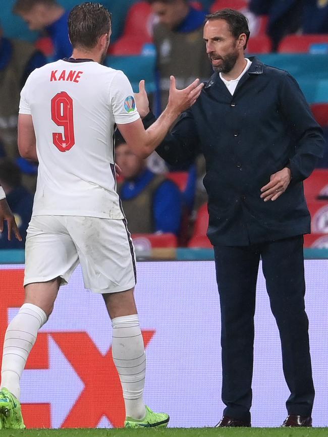 England’s Harry Kane interacts with head coach Gareth Southgate as he leaves the field. Picture: Getty Images