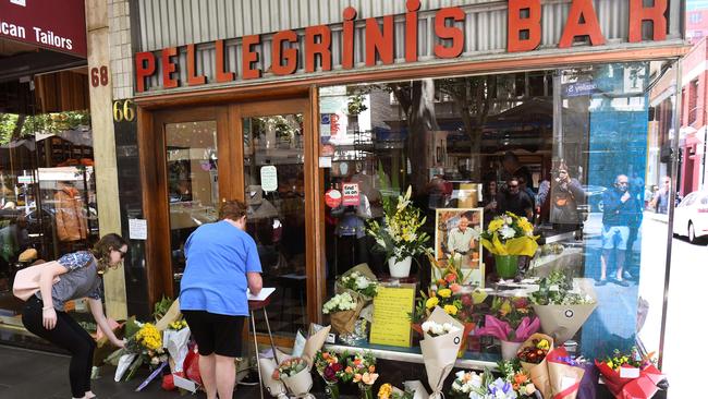 People pay their respects for Sisto Malaspina outside Pellegrini's Espresso Bar. Picture: AFP