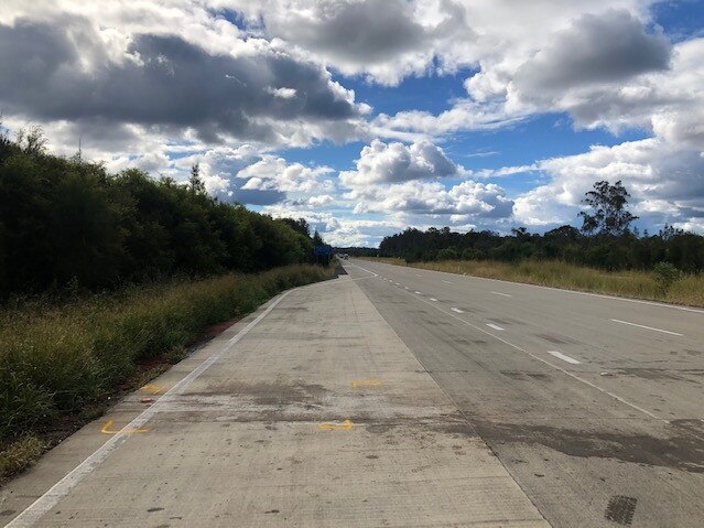 The scene of the crash looking north from a truck stop on the Pacific Highway, near Kempsey. Pic Dan Mills