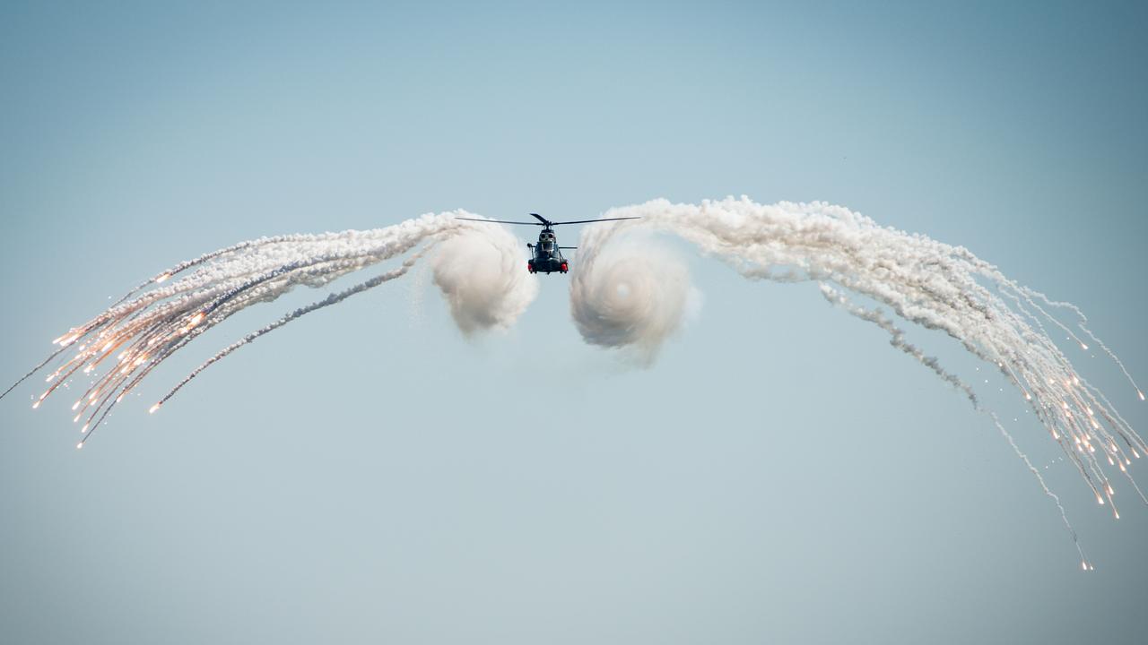 A Romanian helicopter deploys chaff during a Romanian Navy Day. Picture: Jonathan Nelson