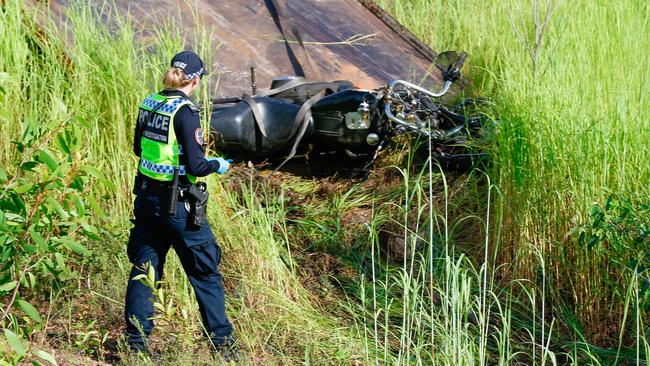 An NT Police accident investigator at the scene of the fatal motorbike accident on Jenkins Road. Picture: Glenn Campbell