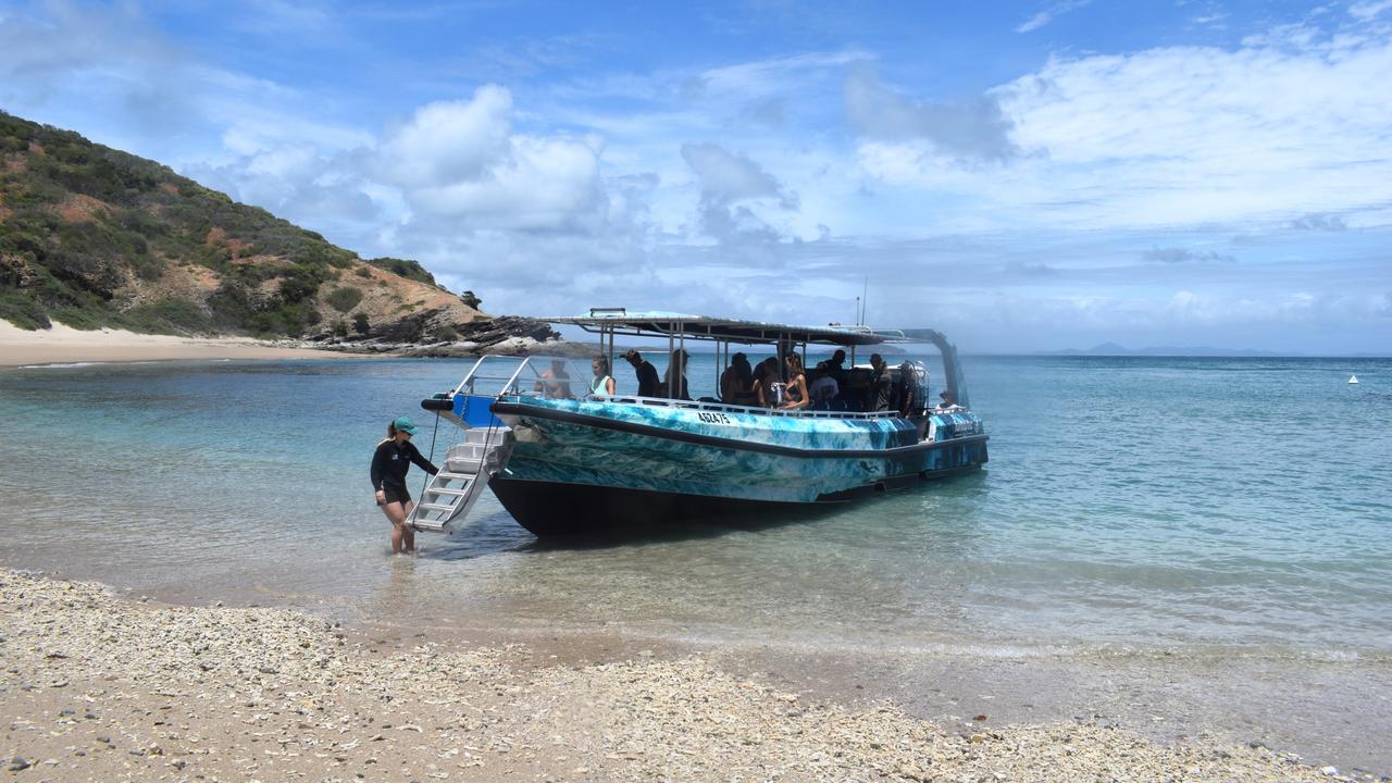 The new boat pulling up for a beach landing at Secret Beach.