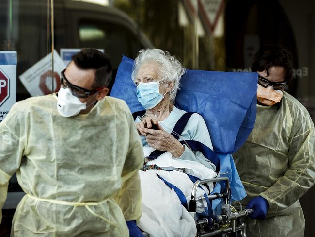 MELBOURNE, AUSTRALIA - JULY 28: A resident of Epping Gardens Aged Care Facility is taken away in a ambulance on July 28, 2020 in Melbourne, Australia. Victoria has recorded 532 new cases of coronavirus and six more deaths, yesterday making it the worst day of the pandemic. Metropolitan Melbourne and the Mitchell shire remain in lockdown due to the rise in COVID-19 cases through community transmissions, with people permitted to leave home only for exercise, work, to buy essential items, or to access childcare and healthcare and individuals are required Face coverings or be subject to a $200 fine. Lockdown measures are in place until August 19. (Photo by Darrian Traynor/Getty Images)