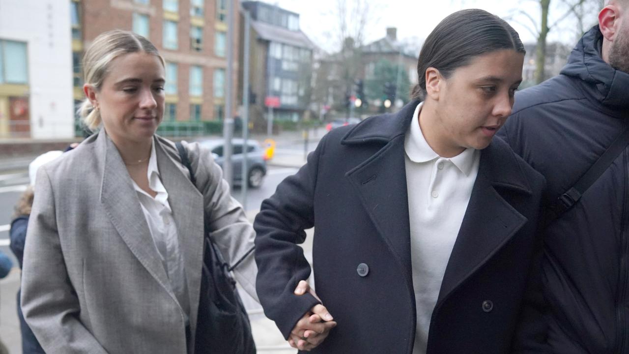 Sam Kerr holds hands with partner Kristie Mewis at Kingston Crown Court. Photo by Jonathan Brady/PA Images via Getty Images.