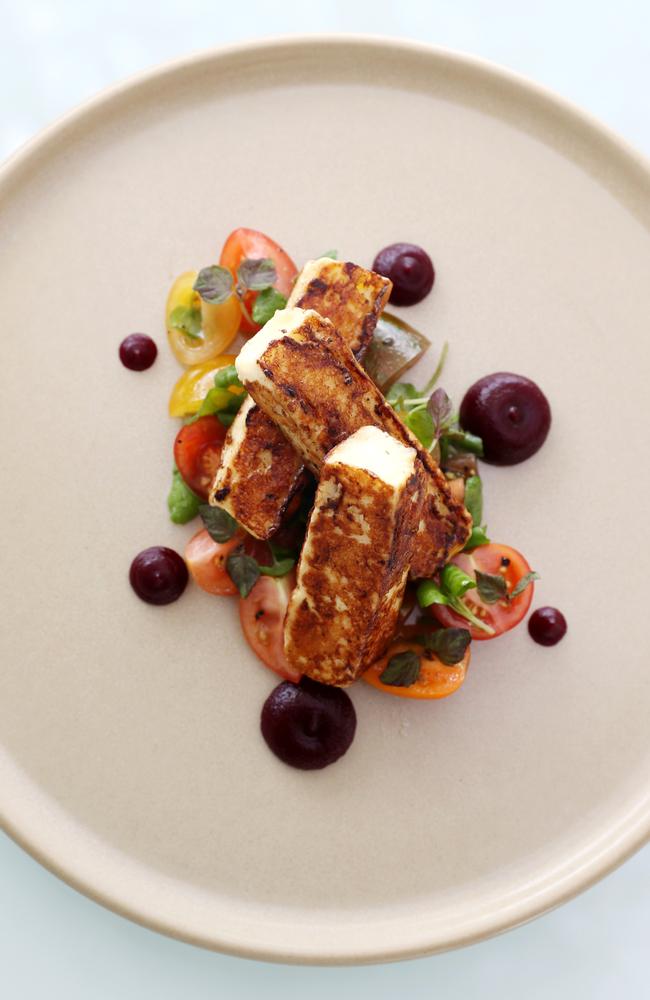 The grilled halloumi is a simple dish with halved heirloom tomatoes, a few sprigs of watercress and a couple of small pools of beetroot and balsamic gel.