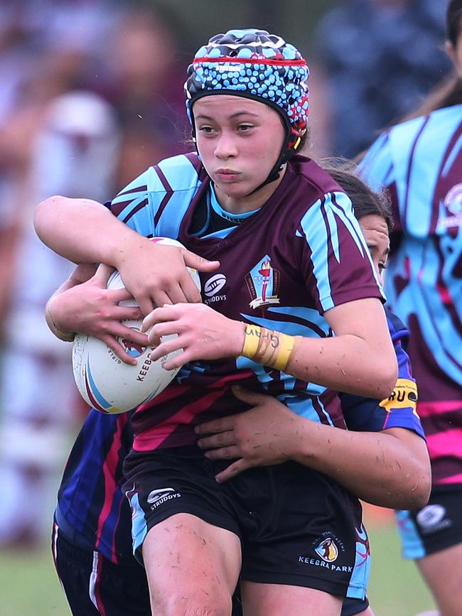 Keebra’s Okalani Compton wrapped up in a tackle. Picture: Glenn Hampson