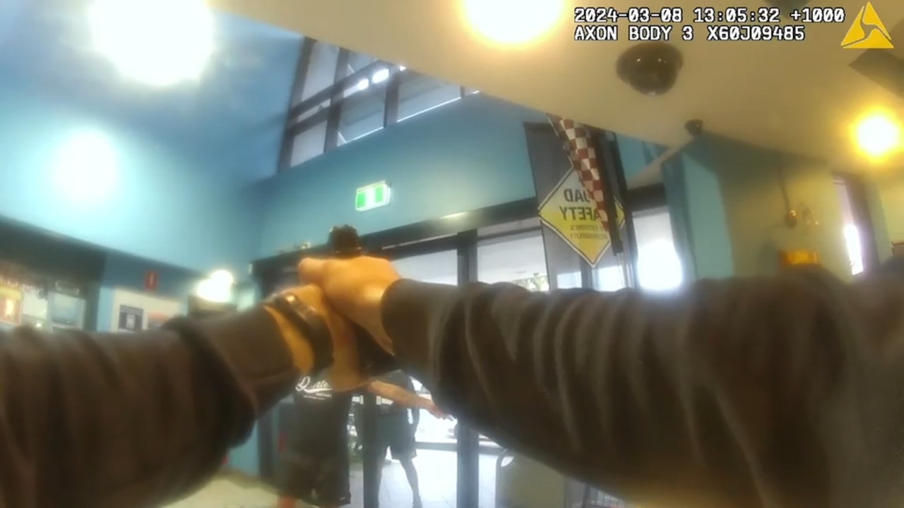 ‘Just f---ing shoot me’: Armed man confronts police at cop shop