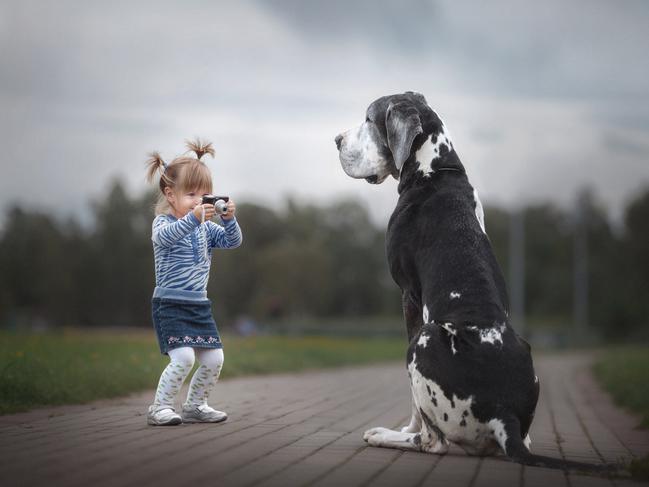 “Little Kids and Their Big Dogs” book celebrates the special bond between children and their super-sized dogs: Ready for my close-up ... Alexandra and Zarmina the Harlequin Great Dane.