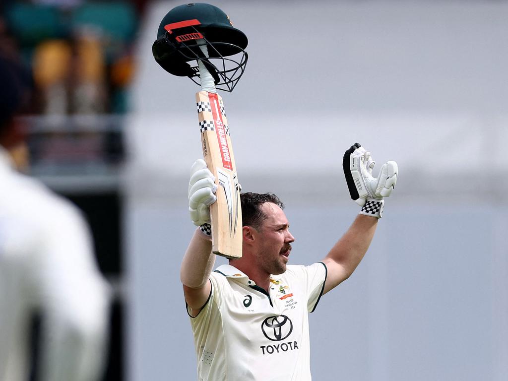 Travis Head celebrates reaching his century in trademark style. Picture: David Gray / AFP