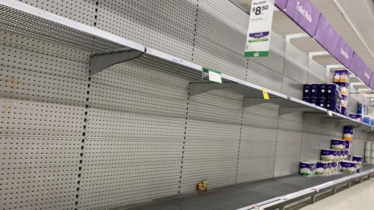 Empty toilet paper shelves at Woolworths in Chermside Shopping Centre. Picture: Brad Fleet