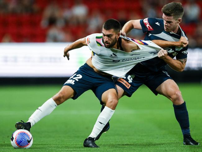 Austin Ayoubi of Adelaide United competes with Connor Chapman of the Victory during the A-League Men round 20 match between Adelaide United and Melbourne Victory at Coopers Stadium, on March 09, 2024, in Adelaide, Australia. Picture: Getty Images