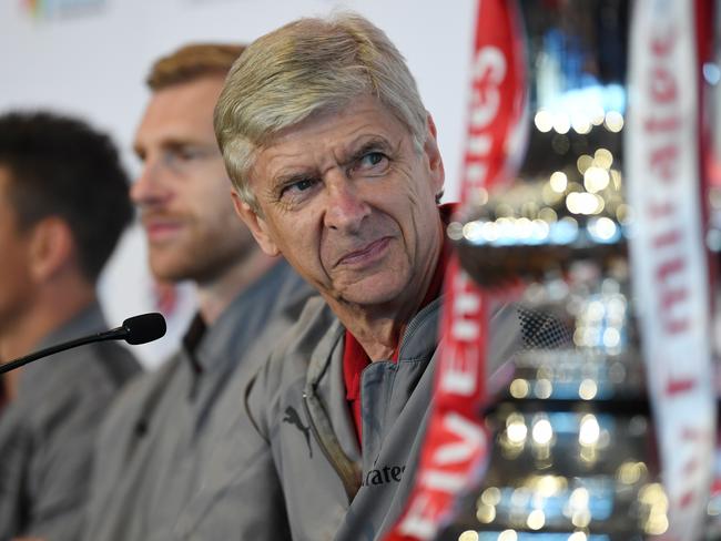 Arsenal manager Arsene Wenger smiles during a press conference with some of his players and Sydney FC manager Graham Arnold at the Museum of Contemporary Art in Sydney, Tuesday, July 11, 2017. (AAP Image/David Moir) NO ARCHIVING