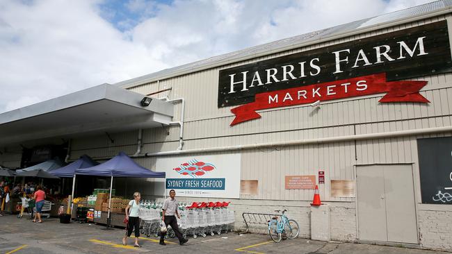 Staff at Harris Farm Markets, Manly, are helping pack the 100 boxes of free fruit and vegetables being distributed each day. Picture: Troy Snook