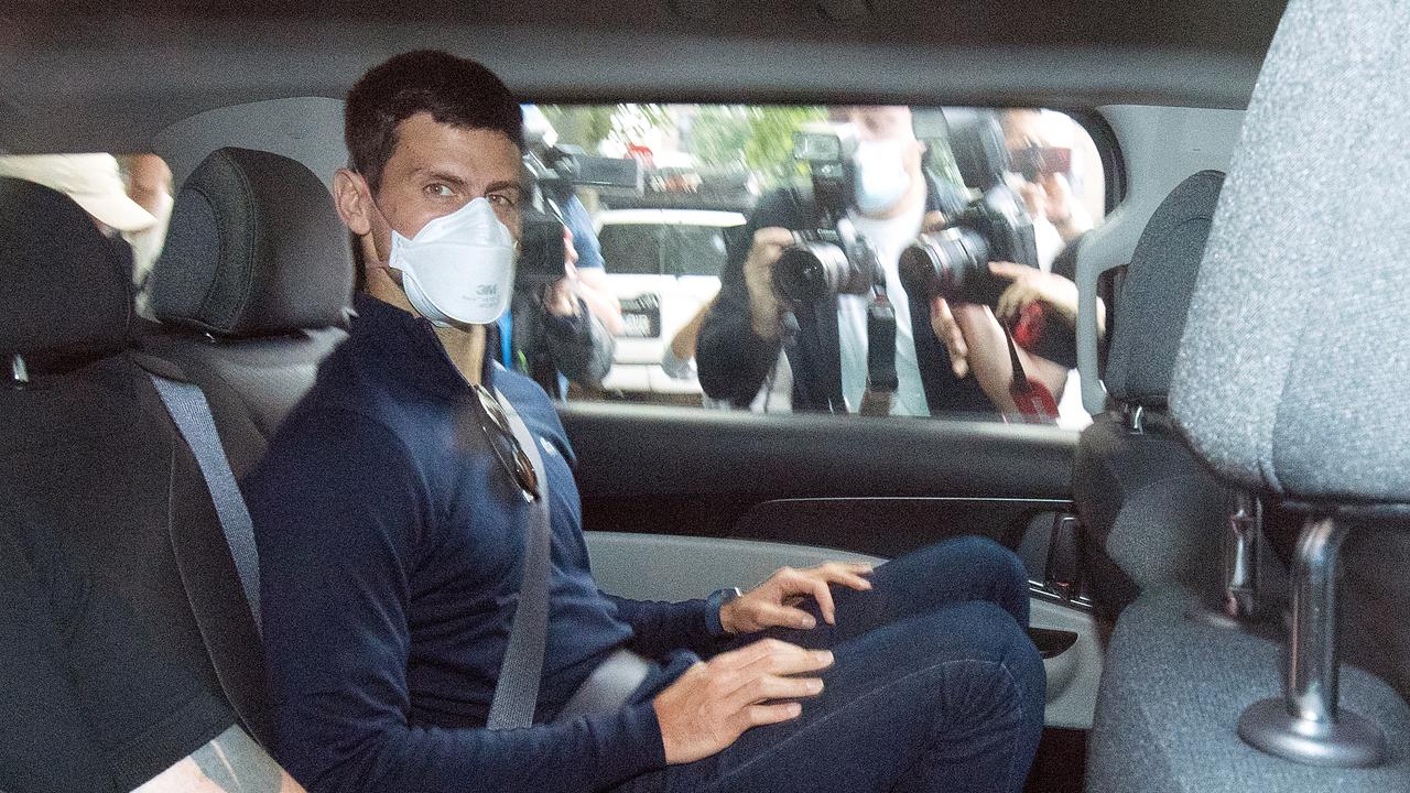 Djokovic leaving the hotel he was detained in. (AAP Image/James Ross)