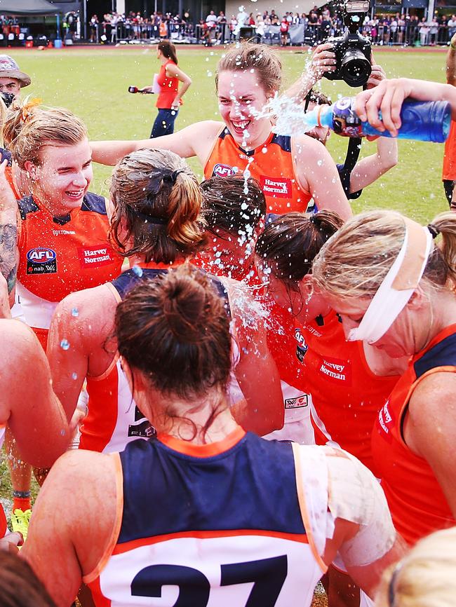 GWS players celebrate their first win of the season. Picture: Getty