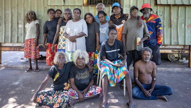 The grieving family of Elaine Naroldol – who was allegedly stabbed to death by her partner – in the Darwin town camp where she lived. Picture: Liam Mendes