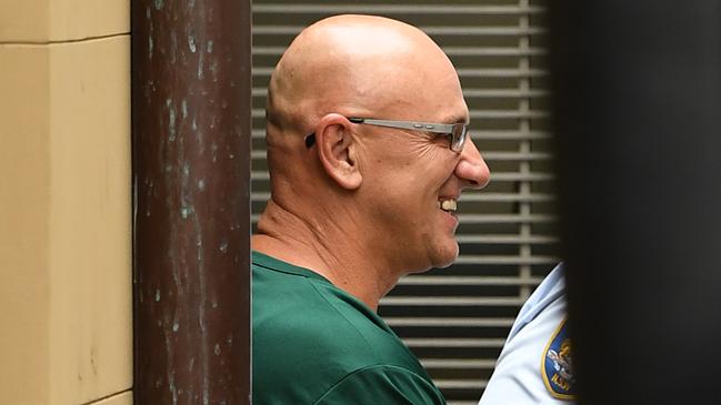 Michael Muho Basanovic is escorted to a prison van at the Supreme Court of NSW in Sydney, Wednesday, December 11, 2019. Former Hells Angel Michael Basanovic has admitted the manslaughter of a high-ranking Sydney bikie. (AAP Image/Joel Carrett) NO ARCHIVING