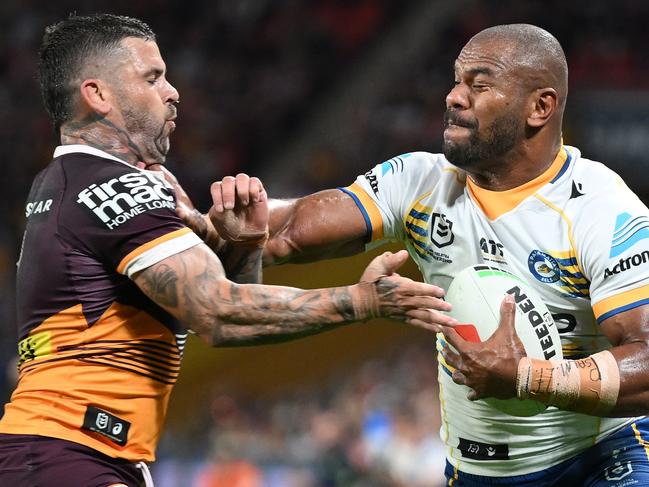 BRISBANE, AUSTRALIA - AUGUST 23: Maika Sivo of the Eels is tackled by Adam Reynolds of the Broncos during the round 25 NRL match between Brisbane Broncos and Parramatta Eels at Suncorp Stadium, on August 23, 2024, in Brisbane, Australia. (Photo by Matt Roberts/Getty Images)