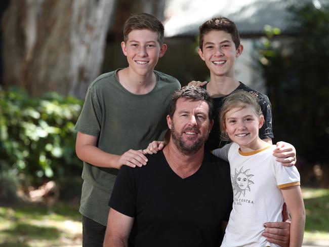 David Wood celebrates Father's Day with his children Geordie, 14, Charlie, 12, and Amelia, 10, at the Palm Cove markets. PICTURE: BRENDAN RADKE