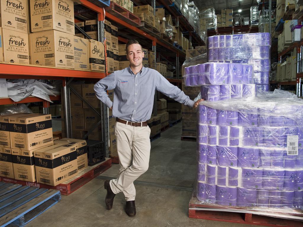 Brock Tuesley, sales manager with Toowoomba Wholesale Distributors stock of pallets and shelving full of toilet paper rolls. Wednesday, 11th Mar, 2020.