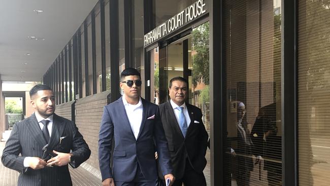 Julian Sebastiao (centre) leaves Parramatta Local Court on February 17, 2021 receiving a conviction.