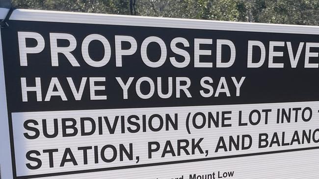 Public consultation signage on the fence line of the Mount Low cattle paddock.