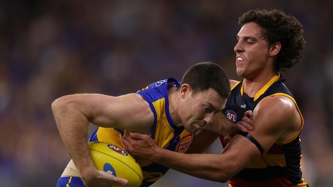 James Borlase tackles West Coast’s Jeremy McGovern during the Crows’ round 24 win over the Eagles. Borlase is one of four Crows who played in that AFL win and will return for Sunday’s SANFL qualifying final against Sturt. Picture: Getty Images