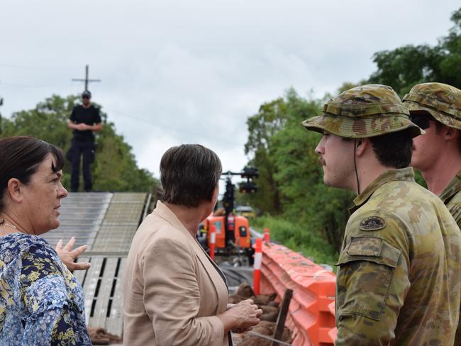 Member for Thuringowa Natalie Marr and Mundingburra MP Janelle Poole talk to soldiers from 3CER at the site of Ollera Creek