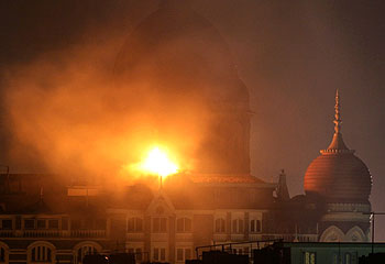 Mumbai ... smoke and fire billows out of the Taj Mahal Hotel. Reuters