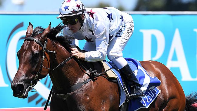 Sit-and-steer job: jockey Luke Currie pilots Sunlight to win the QTIS Two-Years-Old Handicap. Picture: AAP