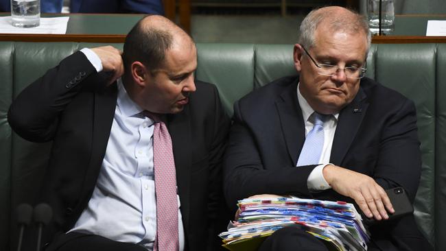 Scott Morrison and Josh Frydenberg speak during House of Representatives question time at Parliament House on Thursday. Picture: AAP