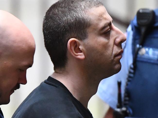 Ali Chaouk (centre) arrives at the Supreme Court of Victoria in Melbourne, Wednesday, November 21, 2018. Mr Chaouk is accused of murdering Mohammed Haddara in Altona North on June 20, 2009. (AAP Image/James Ross) NO ARCHIVING