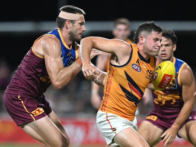 Jake Soligo attempts to break free during Adelaide’s clash with Brisbane. Picture: Getty Images