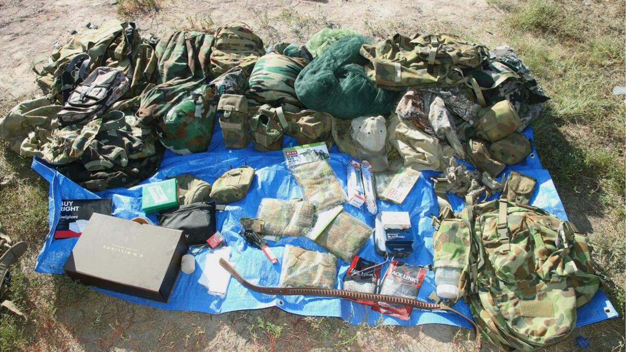A stash of camouflage gear, including bags, caps and pouches, among some of the items found at the Wieambilla property.