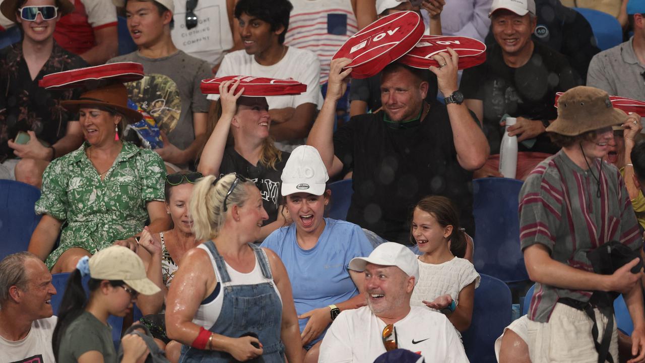 The crowd were in disbelief that every time the players walked out onto the court it started raining. Picture: Martin Keep / AFP