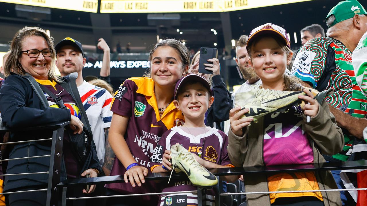 Maddie and Ryatt Jenkins from Varsity Lakes in Queensland, and Lexi Santangelo from Brisbane, with signed boots from Adam Reynolds. Todd Martyn-Jones