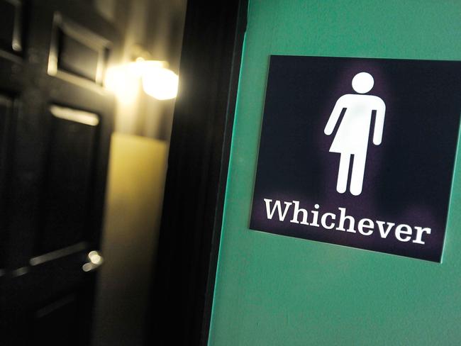 (FILES) This file photo taken on May 10, 2016 shows a gender neutral sign posted outside a bathroom at Oval Park Grill in Durham, North Carolina. Germany's top court on November 8, 2017 required parliament to legally recognise a "third gender" from birth, potentially making it the first European country to offer intersex people the option of identifying as neither male nor female. / AFP PHOTO / GETTY IMAGES NORTH AMERICA / SARA D. DAVIS